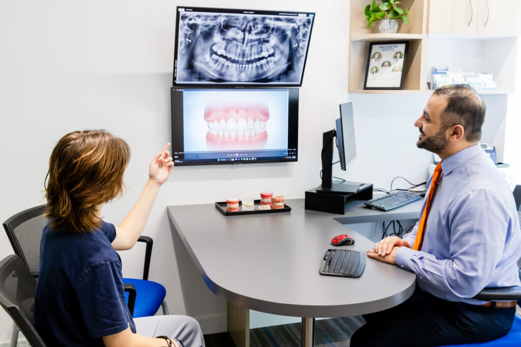 Orthodontist talking to a patient about inbrace in West Springfield, VA.